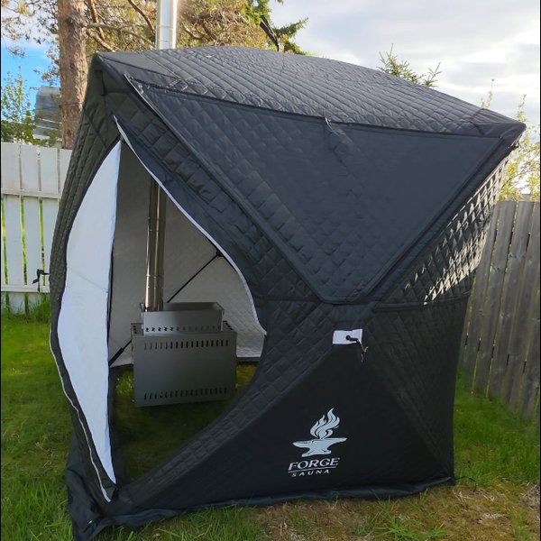 Wood-fired tent sauna setup
